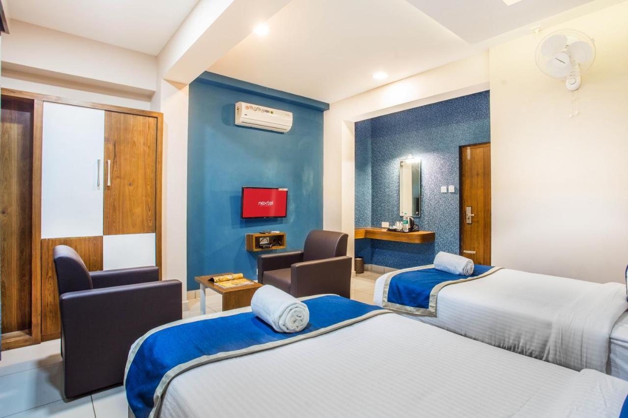 Nextel Inn, Calicut Extérieur photo